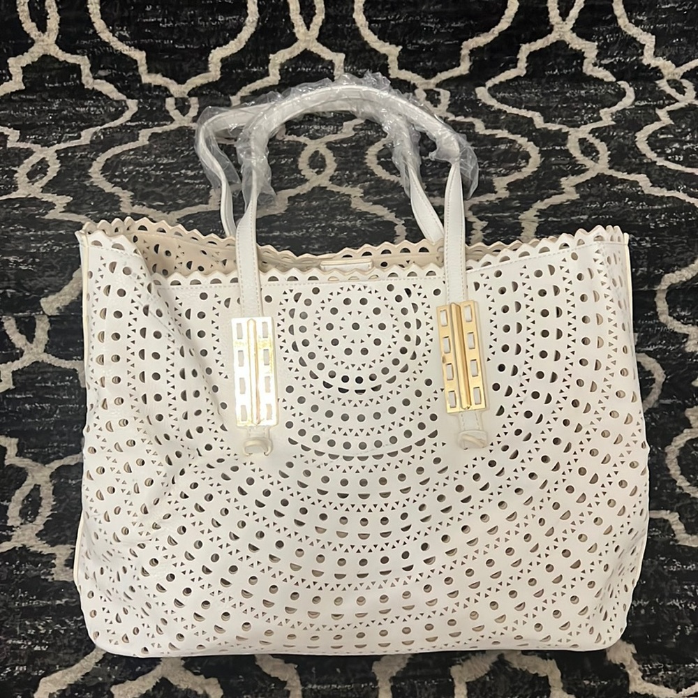 Madison west, white handbag.